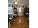 A spacious living room with wood floors, decorated with masks and plants at 315 Saratoga Pl, Riverdale, GA 30296