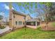 Beautiful home featuring a screened-in porch and a lush, green backyard at 1421 Briarcliff Dr, Woodstock, GA 30189