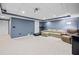 Basement featuring plush carpeting, neutral walls, and a comfortable seating area with a projector setup at 1421 Briarcliff Dr, Woodstock, GA 30189