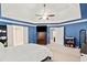Spacious bedroom with tray ceilings, and TV, offering comfort and style at 1421 Briarcliff Dr, Woodstock, GA 30189