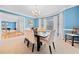 Bright dining room with elegant decor, a large window, and views of the foyer at 1421 Briarcliff Dr, Woodstock, GA 30189