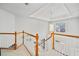 Foyer with wood banister, statement pendant light, and high ceilings at 1421 Briarcliff Dr, Woodstock, GA 30189