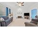 Inviting living room with cozy fireplace, carpet, and plenty of space for relaxation and entertaining at 1421 Briarcliff Dr, Woodstock, GA 30189
