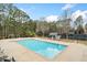 A stunning community pool with bath house, hot tub, and mature trees at 1421 Briarcliff Dr, Woodstock, GA 30189
