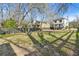 Spacious backyard offering plenty of room for outdoor activities, bordered by a wooden fence at 1450 Donald Lee Hollowell Nw Pkwy, Atlanta, GA 30318