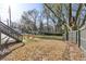 Large, fenced backyard with stairs leading up to the back of the house, providing privacy and security at 1450 Donald Lee Hollowell Nw Pkwy, Atlanta, GA 30318