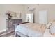 Cozy bedroom with a neutral color palette, a dresser, and hardwood floors at 1450 Donald Lee Hollowell Nw Pkwy, Atlanta, GA 30318