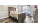 Spacious bedroom with a large window, hardwood floors, and neutral paint at 1450 Donald Lee Hollowell Nw Pkwy, Atlanta, GA 30318