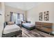 Nicely decorated bedroom featuring two twin beds, grey curtains, and hardwood floors at 1450 Donald Lee Hollowell Nw Pkwy, Atlanta, GA 30318