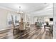 Inviting dining room with wood floors, stylish chairs, and seamless access to living areas at 1450 Donald Lee Hollowell Nw Pkwy, Atlanta, GA 30318
