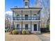 Inviting two-story home with a double porch, featuring classic architectural details at 1450 Donald Lee Hollowell Nw Pkwy, Atlanta, GA 30318