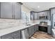 Stylish kitchen with grey cabinetry, stainless steel appliances, and ample counter space at 1450 Donald Lee Hollowell Nw Pkwy, Atlanta, GA 30318