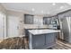 Modern kitchen featuring a center island, grey cabinets, and stainless steel appliances at 1450 Donald Lee Hollowell Nw Pkwy, Atlanta, GA 30318