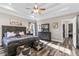 A spacious main bedroom suite boasts trey ceilings, hardwood floors, and abundant natural light at 1450 Donald Lee Hollowell Nw Pkwy, Atlanta, GA 30318