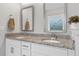 Bathroom vanity with granite countertop, double sinks and modern fixtures at 200 Oakside Way, Lawrenceville, GA 30046