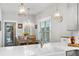Bright dining area featuring a chandelier and a view to the backyard at 200 Oakside Way, Lawrenceville, GA 30046