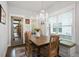 Cozy dining area with a bench seat and plenty of natural light at 200 Oakside Way, Lawrenceville, GA 30046