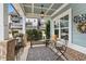 Charming front porch with seating, brick accents and a view of the neighborhood at 200 Oakside Way, Lawrenceville, GA 30046