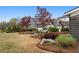 Well-maintained community space with lush landscaping, mature trees, and inviting benches at 200 Oakside Way, Lawrenceville, GA 30046