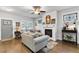 Open-concept living room with hardwood floors, fireplace, and comfortable seating at 200 Oakside Way, Lawrenceville, GA 30046
