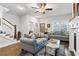 Spacious living area with hardwood floors, comfortable couches, and staircase at 200 Oakside Way, Lawrenceville, GA 30046