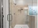 Walk in shower with glass door and frosted bird-silhouette sticker on a window at 200 Oakside Way, Lawrenceville, GA 30046