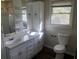 Bathroom featuring double vanity, toilet, and shower at 2076 Dobbins Nw Dr, Kennesaw, GA 30144