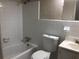 Functional bathroom with tiled walls, a tub-shower combination, and a vanity sink at 2076 Dobbins Nw Dr, Kennesaw, GA 30144
