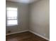 A simple room with hardwood floors and a window at 2076 Dobbins Nw Dr, Kennesaw, GA 30144