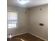 Cozy bedroom featuring natural light through a window and hardwood floors at 2076 Dobbins Nw Dr, Kennesaw, GA 30144