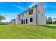 A large, grassy backyard view of the exterior of a two-story white home at 380 Waterbluff Dr, Mableton, GA 30126