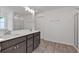 Bright bathroom with double sink vanity, and glass shower with tile surround at 380 Waterbluff Dr, Mableton, GA 30126