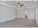 Spacious bedroom with tray ceilings, ceiling fan and a neutral carpet flooring at 380 Waterbluff Dr, Mableton, GA 30126