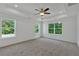 Large bedroom with natural light, a ceiling fan and neutral carpet flooring at 380 Waterbluff Dr, Mableton, GA 30126