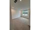 The carpeted bedroom features a bright window at 380 Waterbluff Dr, Mableton, GA 30126