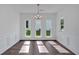 Elegant dining area featuring hardwood floors, natural light, and classic trim at 380 Waterbluff Dr, Mableton, GA 30126