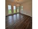 Bright dining room featuring wainscoting, hardwood floors, and large windows at 380 Waterbluff Dr, Mableton, GA 30126
