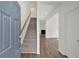 Bright foyer with hardwood floors, staircase, and access to the living spaces at 380 Waterbluff Dr, Mableton, GA 30126