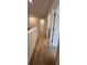 Carpeted hallway with white walls and doors leading to other rooms at 380 Waterbluff Dr, Mableton, GA 30126