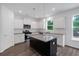 Bright kitchen featuring granite counters, center island, stainless appliances, and ample cabinet space at 380 Waterbluff Dr, Mableton, GA 30126