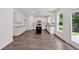 Modern kitchen with white cabinets, granite countertops, stainless steel appliances, and hardwood floors at 380 Waterbluff Dr, Mableton, GA 30126