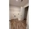 Neat laundry room with wood-look flooring and wire shelving at 380 Waterbluff Dr, Mableton, GA 30126
