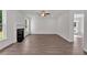 Cozy living room with fireplace, hardwood floors, and ample space for relaxation at 380 Waterbluff Dr, Mableton, GA 30126