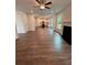 Spacious living room with fireplace, open to the kitchen, with hardwood floors and natural light at 380 Waterbluff Dr, Mableton, GA 30126