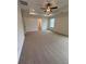 Spacious carpeted main bedroom with ceiling fan and large window at 380 Waterbluff Dr, Mableton, GA 30126
