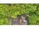 Aerial view of the home's roof, the deck/patio, and the surrounding trees at 3951 Lorien Nw Way, Kennesaw, GA 30152