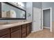 Elegant bathroom featuring a double vanity, a framed mirror, and a neutral color scheme at 3951 Lorien Nw Way, Kennesaw, GA 30152