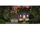 Charming two-story red brick home with an attached two-car garage set at sunset at 3951 Lorien Nw Way, Kennesaw, GA 30152