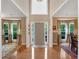 Elegant foyer with gleaming hardwood floors, large windows, and an open layout to the living spaces at 3951 Lorien Nw Way, Kennesaw, GA 30152