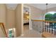 Hallway with a staircase leading to the bedroom, featuring a decorative window and carpeted floors at 3951 Lorien Nw Way, Kennesaw, GA 30152